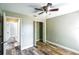 Bright bedroom showing closet space, door and natural light from the window at 1456 Providence Blvd, Deltona, FL 32725