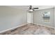 Bedroom with wood-look tile, natural light and standard closet at 1456 Providence Blvd, Deltona, FL 32725