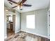 Dining room with wood-look tile, natural light, and views to the kitchen at 1456 Providence Blvd, Deltona, FL 32725