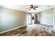 Bright living room featuring stylish floors, a ceiling fan, and glass doors to the backyard at 1456 Providence Blvd, Deltona, FL 32725