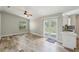 Spacious living room with stylish floors, a ceiling fan, and French doors leading to the outdoor space at 1456 Providence Blvd, Deltona, FL 32725