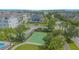 Aerial view of a community basketball court surrounded by lush landscaping and modern homes at 14691 Walcott Ave, Orlando, FL 32827