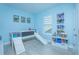 Playful blue ' bedroom with comic decor, a loft bed, and a slide at 14691 Walcott Ave, Orlando, FL 32827