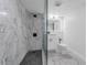 Contemporary bathroom featuring marble shower and modern black fixtures at 151 E Washington St # 419, Orlando, FL 32801