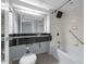 Bright and airy bathroom featuring a tiled shower with new showerhead and granite vanity at 151 E Washington St # 419, Orlando, FL 32801
