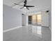 Bright bedroom with a ceiling fan, large windows and balcony access, and tiled floors at 151 E Washington St # 419, Orlando, FL 32801