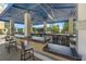 Poolside outdoor grilling station with bar stool seating and a blue awning at 151 E Washington St # 419, Orlando, FL 32801