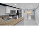 Bright kitchen with stainless steel appliances and granite countertops, open to the living space at 151 E Washington St # 419, Orlando, FL 32801
