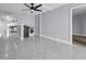 Open concept living area with a laundry space and a large format tiled floor at 151 E Washington St # 419, Orlando, FL 32801