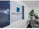 Lobby featuring a decorative sign, seating, and a large indoor plant at 151 E Washington St # 419, Orlando, FL 32801