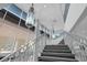 Staircase with a decorative railing and modern lighting at 151 E Washington St # 419, Orlando, FL 32801