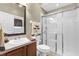 This bathroom features a modern glass shower, vanity with sink, and neutral finishes for a clean aesthetic at 158 Cedar Springs Cir, Debary, FL 32713