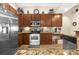 Well-equipped kitchen featuring stainless steel appliances, tile backsplash, and ample cabinetry at 158 Cedar Springs Cir, Debary, FL 32713