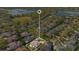 Property highlighted in an aerial community shot close to the lake, baseball field, and lush surroundings at 1649 Kersley Cir, Lake Mary, FL 32746