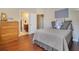 Cozy bedroom with hardwood floors and an ensuite bathroom at 1649 Kersley Cir, Lake Mary, FL 32746