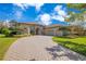 Beautiful single-Gathering home featuring stucco and stone accents, a two-car garage, and a paver driveway at 1649 Kersley Cir, Lake Mary, FL 32746