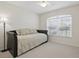 This bedroom features a daybed, neutral walls, and a window with blinds, offering a cozy and bright space at 1740 Efland Ter, Deltona, FL 32738