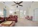 Bright living room featuring neutral walls, a ceiling fan, and comfortable seating at 1740 Efland Ter, Deltona, FL 32738