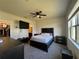 Comfortable bedroom featuring carpet, and a view of the ensuite bathroom at 1825 Cayman Cove Cir, St Cloud, FL 34772