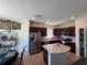 Well-equipped kitchen featuring stainless steel appliances, an island and tile flooring at 1825 Cayman Cove Cir, St Cloud, FL 34772