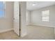 Bright, empty bedroom with neutral walls and carpet, enhanced by natural light at 18381 Oliver Twist Way, Winter Garden, FL 34787