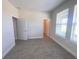 Bright bedroom featuring gray wood-look flooring and abundant natural light at 18381 Oliver Twist Way, Winter Garden, FL 34787