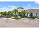 Attractive building exterior with well-maintained landscaping, parking and architectural features at 18381 Oliver Twist Way, Winter Garden, FL 34787