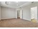 Spacious main bedroom with carpet flooring and entryways to a walk-in closet and an en-suite bathroom at 18381 Oliver Twist Way, Winter Garden, FL 34787