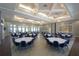 Large meeting room featuring multiple round tables, modern lighting, and large windows at 18381 Oliver Twist Way, Winter Garden, FL 34787