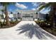 Inviting outdoor seating beneath a pergola with comfortable furniture and manicured landscaping at 18381 Oliver Twist Way, Winter Garden, FL 34787