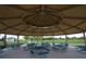 Large, covered pavilion offering ample seating and a gathering spot, perfect for picnics and community events at 18381 Oliver Twist Way, Winter Garden, FL 34787