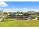 Community playground and picnic area surrounded by lush green lawns and mature trees with scenic views at 18381 Oliver Twist Way, Winter Garden, FL 34787