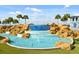 Beautiful water feature in the community surrounded by lush landscaping and palm trees, enhancing the property's aesthetic appeal at 18381 Oliver Twist Way, Winter Garden, FL 34787