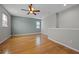 Versatile bonus room with wood flooring, ceiling fan, and natural light at 2204 Hammock Moss Dr, Orlando, FL 32820