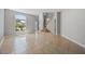 Bright, tiled foyer showcasing a large window and elegant staircase at 2204 Hammock Moss Dr, Orlando, FL 32820