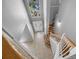 High angle view of the foyer with staircase, tiled floor, and decorative front door at 2204 Hammock Moss Dr, Orlando, FL 32820
