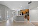 Bright kitchen features bar seating, ample cabinet space and seamless flow to dining and pool area at 2204 Hammock Moss Dr, Orlando, FL 32820