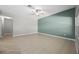 Open living room with large format tile flooring, neutral walls, and ceiling fan at 2204 Hammock Moss Dr, Orlando, FL 32820