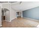 Open-concept living room with tile floors, neutral paint, and archway leading to dining room at 2204 Hammock Moss Dr, Orlando, FL 32820