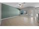 Spacious living room with tiled floor, ceiling fan, and natural light, offering comfortable living space at 2204 Hammock Moss Dr, Orlando, FL 32820