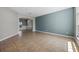 Spacious living area with neutral tones, tile flooring, and abundant natural light at 2204 Hammock Moss Dr, Orlando, FL 32820