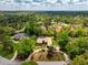 An aerial view captures the home's position on a lush, tree-lined street at 2733 Deer Berry Ct, Longwood, FL 32779