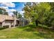 Aerial view of a back yard with a lush lawn, screened-in pool, and partial home view at 2733 Deer Berry Ct, Longwood, FL 32779