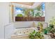 Oversized bathtub with jets and multiple plants creating privacy at 2733 Deer Berry Ct, Longwood, FL 32779