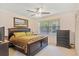 Bedroom with furniture set, ceiling fan, and large window with blinds at 2733 Deer Berry Ct, Longwood, FL 32779