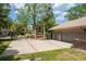 Home featuring a concrete driveway, tile roof, two-car garage, and well-maintained landscaping at 2733 Deer Berry Ct, Longwood, FL 32779