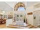 Bright foyer features tile flooring, double doors, and chandelier at 2733 Deer Berry Ct, Longwood, FL 32779