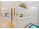 View of hallway with built in storage topped with flower arrangement leading to other rooms at 2733 Deer Berry Ct, Longwood, FL 32779