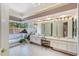 Bright and luxurious main bathroom with soaking tub, dual vanities, and natural light at 2733 Deer Berry Ct, Longwood, FL 32779