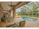 Enclosed patio with pool, hot tub, outdoor kitchen and seating area at 2733 Deer Berry Ct, Longwood, FL 32779